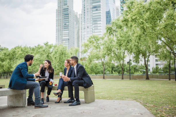 istock Colleagues on a lunch break in the park 1202933086