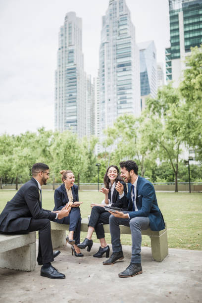 istock Colleagues on a lunch break in the park 1202933177