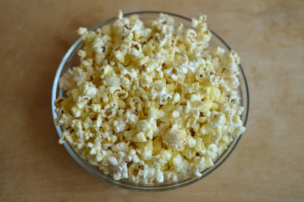 istock A pile of popcorn in a bowl top view 1202933297