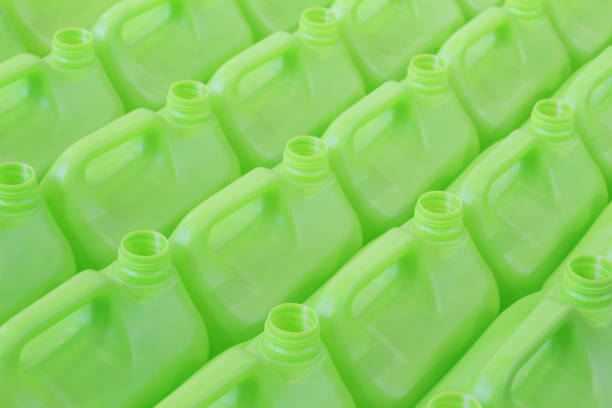 a lot of bottles without lids made of green plastic. - propylene imagens e fotografias de stock