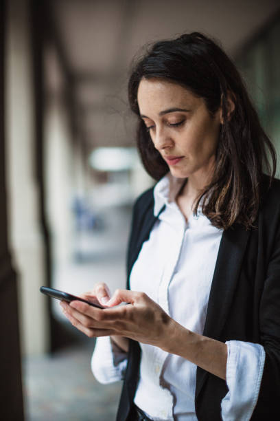 istock Businesswoman using mobile phone 1202934560