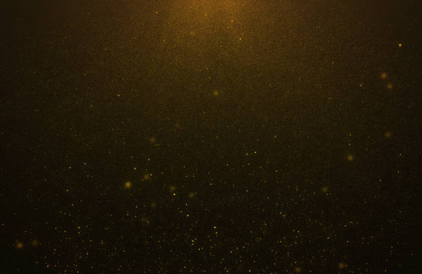 istock Abstract bokeh glitter lights background of flickering gold particles and light flare 1202935926