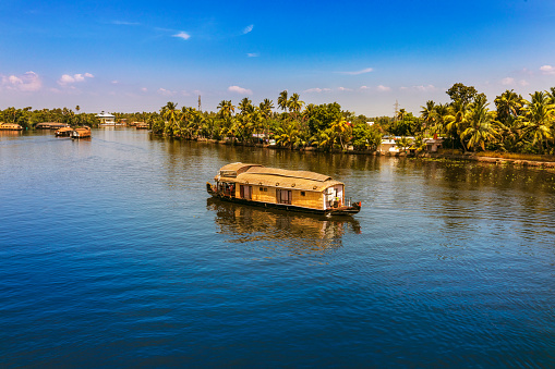House boat wading through Alappuzha Backwaters. in Kerala India