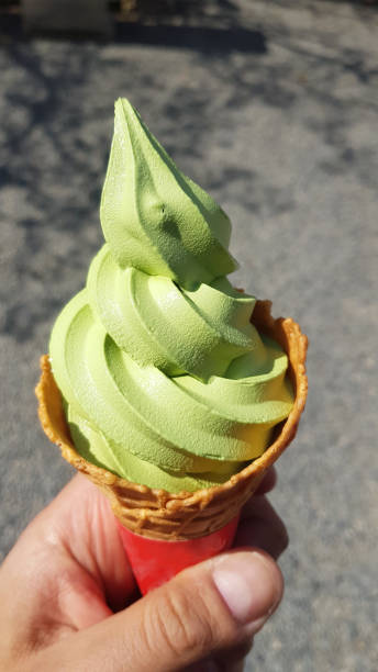istock Green tea ice cream in a cone 1202938514