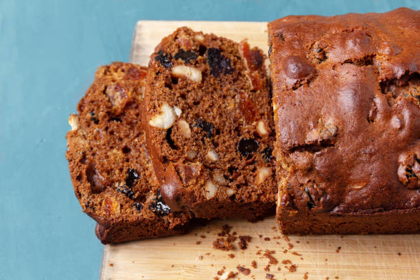 istock Homemade baking and cooking. Cupcake with raisins, nuts and orange 1202940083