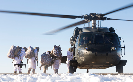Şırnak, Turkey - January 27, 2020: Turkish Army soldiers boarding a Sikorsky UH-60 Black Hawk military helicopter during an operation against PKK terrorist organization in winter. 
(ATTENTION FOR INSPECTOR: This photo was produced at a public location where photographic rights are not protected. It is not a military base. There s no need for property release.)