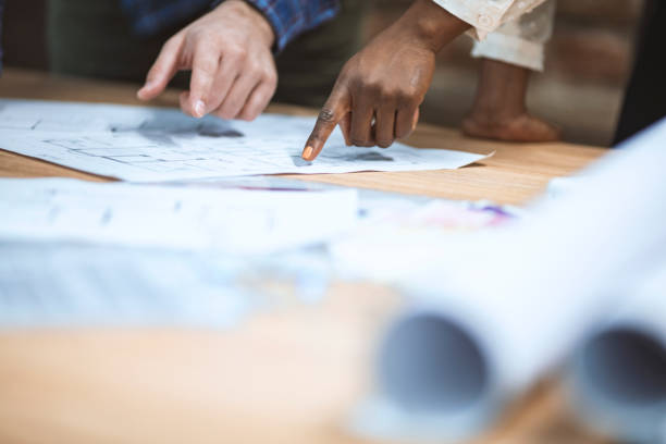 istock Close up of a coworkers working on a project. 1202944100