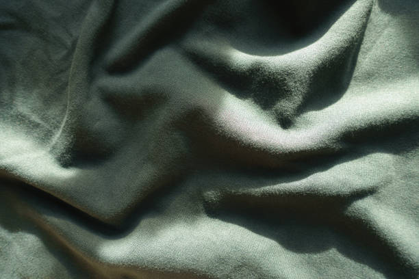 istock Jammed dark green jersey fabric from above 1202944132