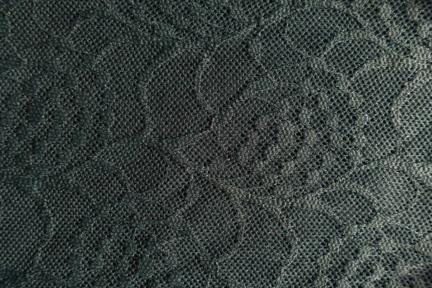 istock Top view of dark green lace with floral pattern 1202944340