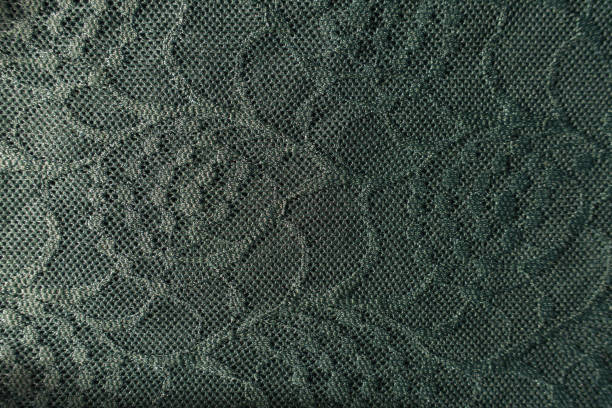 istock Delicate dark green lacy fabric from above 1202944356
