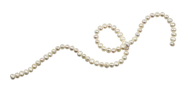 String of freshwater pearls String of freshwater pearls isolated on white necklace stock pictures, royalty-free photos & images