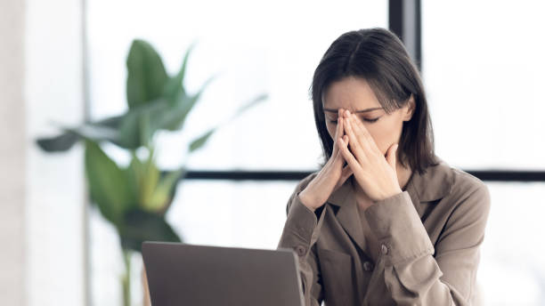 istock European manager doing nose massage at home 1202952130