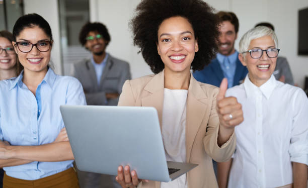 istock Successful team of young perspective businesspeople in office 1202955009