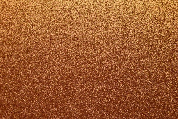 istock Golden shiny background, yellow sparkles, brown grainy texture. Material pattern, metallic tinsel, decoration. 1202956033