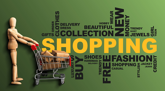 Shopping Wordcloud Collage With Wooden Man And Shopper Cart On Green Background. Panorama