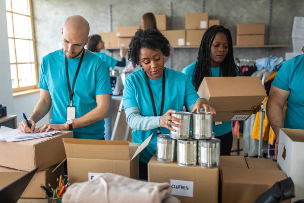 istock Volunteers packing humanitarian aid 1202957529