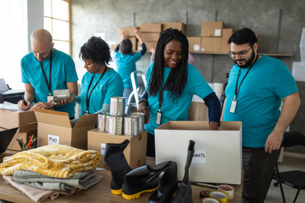 istock Group of multi-ethnic volunteers working in charitable foundation 1202957565