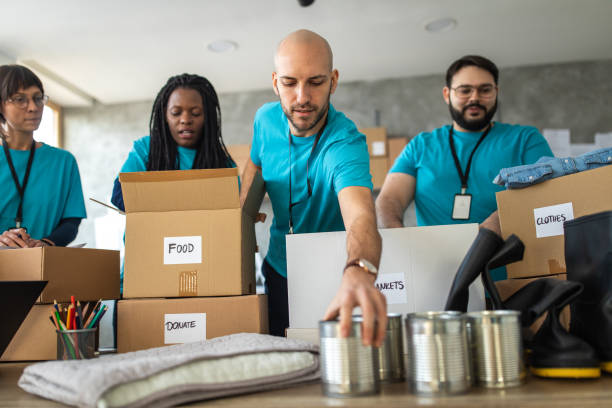 istock Volunteers packing humanitarian aid 1202957662