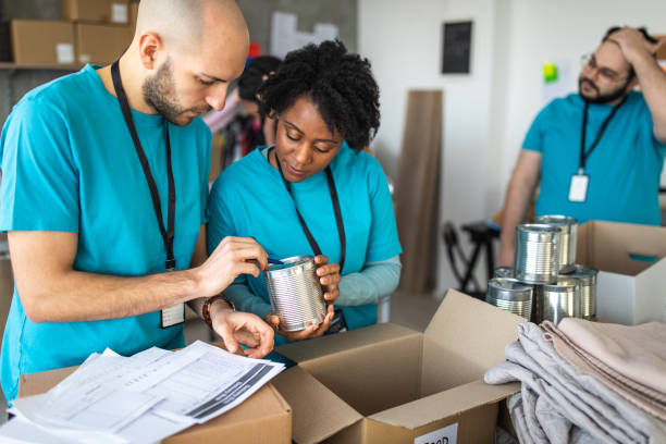 istock Group of multi-ethnic volunteers working in charitable foundation 1202957669