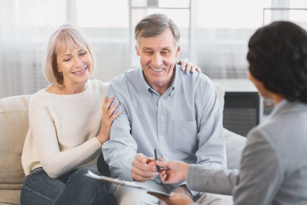 istock Senior couple visiting financial advisor at office 1202957775