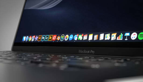 macbook pro 16 inch with touchbar. focus on macbook pro logo - apple macintosh laptop apple computers computer imagens e fotografias de stock