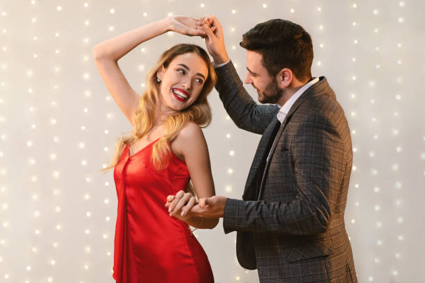 istock Cheerful Romantic Couple Dancing Together On Date In Restaurant 1202959200