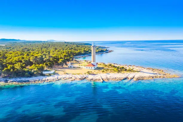 Croatia, Adriatic coast, lighthouse of Veli Rat on the island of Dugi Otok, sunrise over beautiful seascape