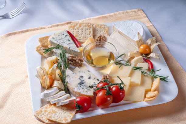 istock Plate with different varieties of cheese 1202960561