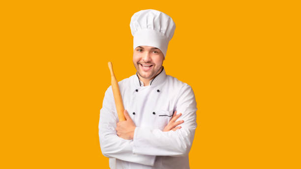 istock Chef Man Holding Rolling Pin Standing On Yellow Background, Panorama 1202962935