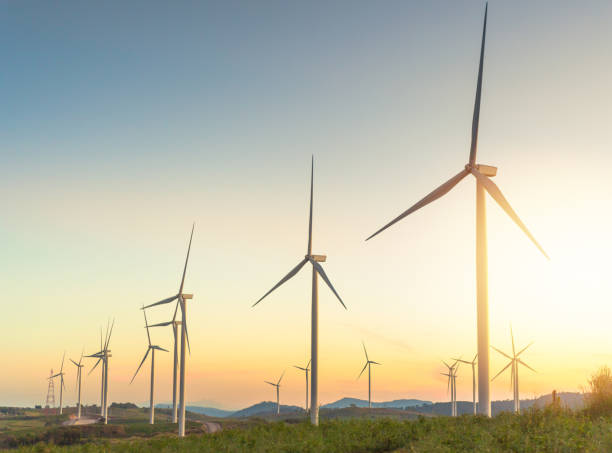 Nature wind turbines and solar panels with high voltage electricity power line for clean energy in mountains Wind turbine replace old coal power plant with high voltage electricity power line for clean energy windmill sunset stock pictures, royalty-free photos & images