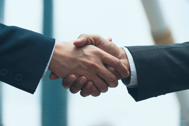 istock Group of men touch hand together 1202964815