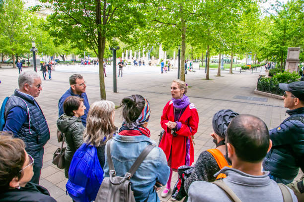 Budapest Tourist guide Budapest,Hungary 01 May 2019 :Tour guide explains to tourists about Budapest guidebook stock pictures, royalty-free photos & images