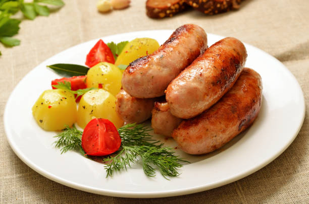 istock Barbecue sausages and boiled potatoes 1202966641