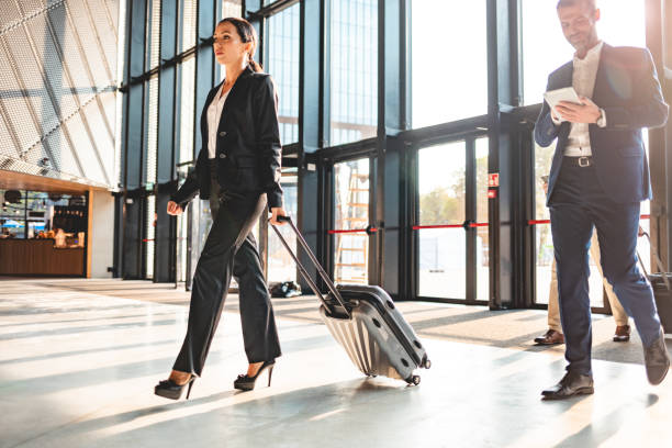 istock Business people at airport hall 1202967427