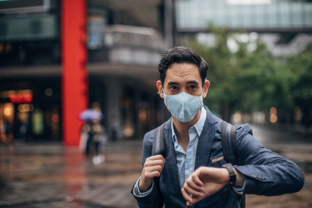 istock Gentleman with in coronavirus infected city wearing a pollution mask 1202968331