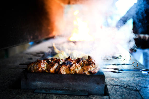 istock Juicy slices of meat prepare on fire 1202968361