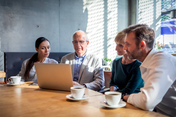 istock Business people talking about project in a cafe 1202968549
