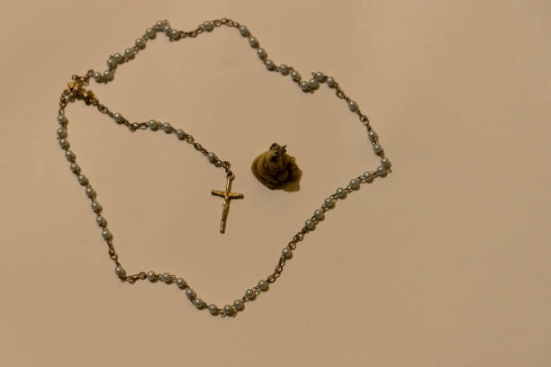 istock The image of a rosary or Catholic third and a crucifix pendant at its end 1202969118