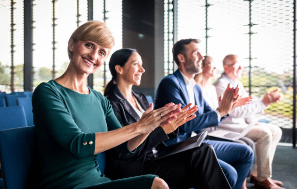 istock Happy audience applauding speaker at business conference 1202969127