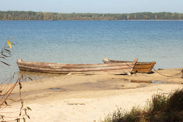 istock Boat moored on the lake shore. 1202969216