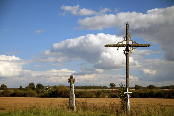 istock The two crosses in the prairie with the clouds 1202970825