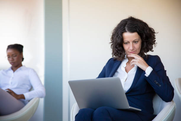 istock Concentrated businesswoman using laptop computer 1202971227