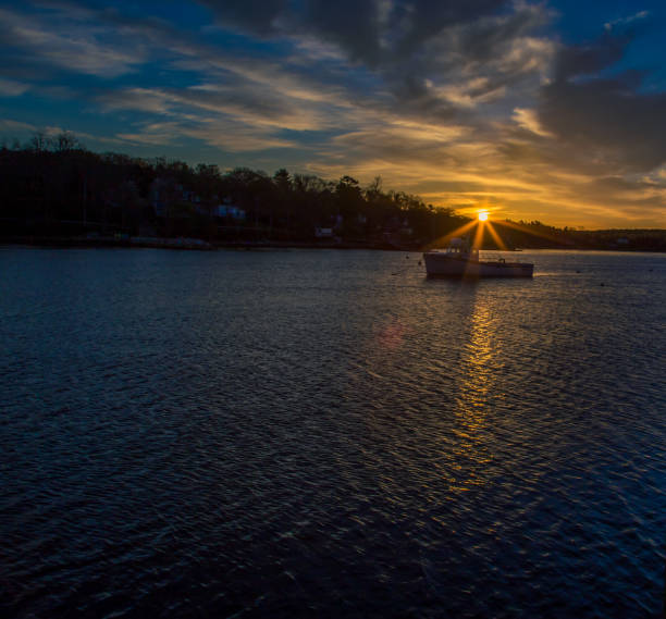 istock Sun rising in a harbor in Nova Scotia 1202972069