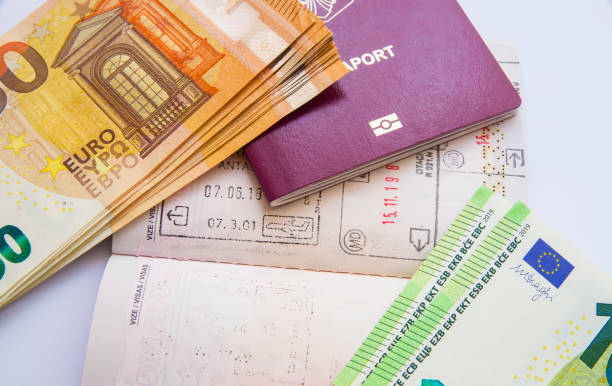 Euro currency and passport visa stamps