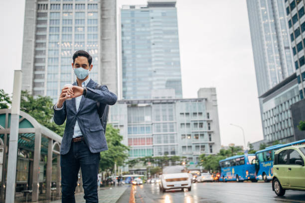 istock Gentleman with in coronavirus infected city wearing a pollution mask 1202976363