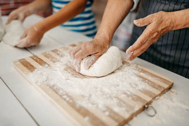 istock Family Cooking Together 1202977122