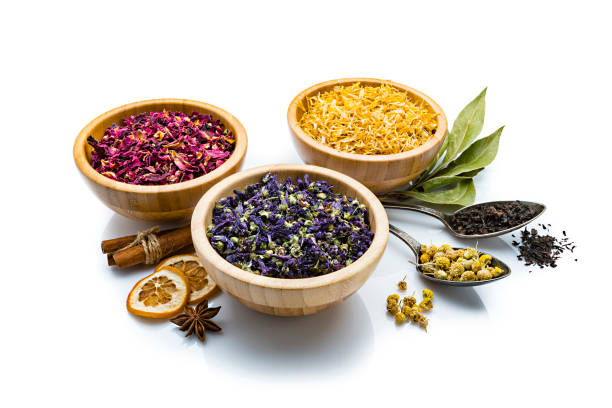 istock Herbal tea: various multi colored dried tea leaves and flowers isolated on white background 1202977714
