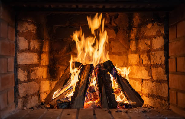 istock Firewood burning in a fireplace close-up 1202977789