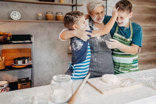 istock Grandma and grandchildren in the kitchen 1202977984