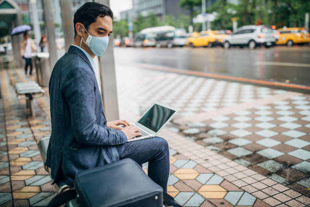 istock Gentleman with pollution mask in coronavirus infected city downtown 1202978005